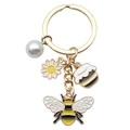 Golden bee keychain with daisy and honey pot charms on a white background - Artificial Pearl Flower Honey
