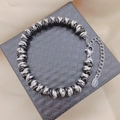 Pulsera trenzada bicolor negra y plateada de acero inoxidable sobre una caja de regalo - 16+5cm / Acero y Negro