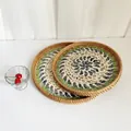 Detail of round rattan trays featuring colorful shell mosaic inlay and woven edges - Turkey / 2-Piece Set