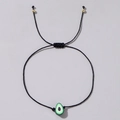 Bracciale artigianale in corda nera con ciondolo avocado in argilla e perline dorate - Avocado