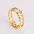 Detailed close-up of golden hollow double cross ring with shimmering micro-set diamonds - US 5 / Gold