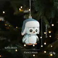 Blue penguin Christmas ornament with white glitter finish hanging on a festive tree - Penguin Style