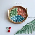 Round rattan tray with colorful floral center and wooden handles for home storage - Red, Blue & Green / Medium 24x3cm