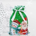 Close-up of green Christmas drawstring gift bag with festive Santa and reindeer patterns - 24*32cm Christmas Green Tone