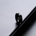 Minimalist black round titanium steel clip-on hoop earring on dark leather background - Single Plain / Black