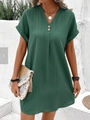Close-up of the V-neckline with decorative buttons on a dark green ribbed summer dress - S / Green
