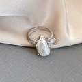 Macro detail of adjustable silver ring with baroque pearl and step-cut side stones - Baroque Pearl with Zircon Style (4 Rings-Silver)