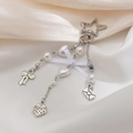 Detailed view of silver star keychain with pearls, bow, heart, and strawberry charms - Silver Star Envelope Style (0204)