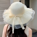 Detail of elegant summer straw sun hat featuring organza ruffled brim and lace bow tie - Solid Color Mesh Veil Creamy White
