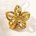 Close-up of golden metal hollow flower hair claw clip with polished finish details - 7.5cm Hollow Frangipani / Gold Yellow