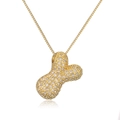 Gold-plated bone-shaped necklace pendant with sparkling zircon stones in a detailed macro view - Letter Y