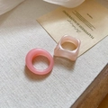 Detail of pink acrylic square and round rings set on a textured beige linen fabric - Pink (2-Piece Set)