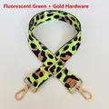 Detail of neon green leopard print nylon strap with gold swivel hooks and buckle - Neon Green + Gold Hook