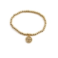 Goldenes Perlenarmband mit funkelndem Zirkon Smiley Anhänger auf weißem Hintergrund - Weißer Zirkonia-Smiley