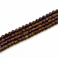 Detailed view of 10mm faceted agate beads with metallic iridescent bronze and purple finish - 10mm / Electroplated Purple
