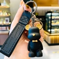 Nordic style black matte bear keychain with yellow bow tie and leather hand strap - Black
