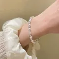 Elegant pearl bracelet with textured silver beads and white lace cuff background - Pink Fine Bead Style / 4MM Bead Diameter