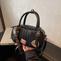 Black leather bowling bag with vintage embroidery patches and stylish bell charm - Black