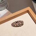 Oval leopard print hair clip for women featuring a stylish resin finish and duckbill grip - Leopard Metal Oval Clip