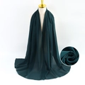 Dark green pearl chiffon long scarf with fine texture shown on a gold neck model - Dark Green