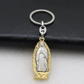 Macro detail of bimetal Virgin of Guadalupe religious keychain on black leather - Keychain (Style 2) / Steel