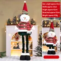 Retractable Christmas snowman plush doll with adjustable long legs in warm home setting - Striped Large 92CM Telescopic Snowman