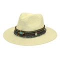 Detail of bohemian straw hat featuring turquoise gemstone, colorful beads and silver coins - Cream