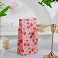 Pink mini paper gift bag with red cherry pattern and white polka dots for party favors - Cherry