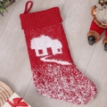 Red knitted Christmas stocking with white house pattern and loop for hanging - House Style
