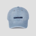 Close-up of CONQUER embroidery and washed denim texture on a light blue baseball cap - M (56-58cm) / Light Blue
