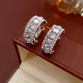 Silver tone C-shaped earrings with square-cut cubic zirconia in a pave setting - Silver Rhinestone Pave C-Shape Stud Earrings