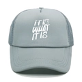 Close-up of grey trucker hat with IT IS WHAT IT IS white print and breathable mesh back - M (56-58cm) / Light Gray