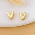 Minimalist 18K gold plated heart stud earrings displayed on a white ceramic plate - Gold Letter V