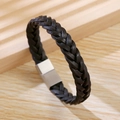 Handmade braided black leather bracelet for men with magnetic clasp on wood background - Black