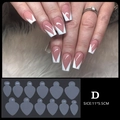 Dettaglio macro degli adesivi per French Manicure a V e loro applicazione su unghie curate - Stile Stampo Unghie D