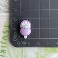Detailed view of mini purple mangosteen resin charm on a grid mat measuring 2.5cm - Purple Mangosteen Popsicle