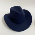 Close-up of a navy blue felt cowboy hat with stitched brim and wide brim detail - Navy Blue