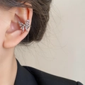 Detail of silver butterfly ear cuff with white zircon stones on a model's ear - 29# Zircon Butterfly Ear Cuff - Left Ear