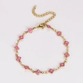 Close-up of pink glitter diamond charms on a gold stainless steel adjustable chain bracelet - Pink