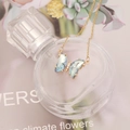 Detail of butterfly pendant with light blue faceted crystal on a gold chain necklace - 3# Light Blue