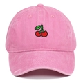 Close-up of red cherry embroidery on pink washed denim baseball cap with fine stitching - Pink