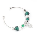 Detail of silver bangle with dark green beads and heart feather charms on white background - Dark Green Feather Style / Green