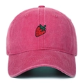 Close-up of red strawberry embroidery on a vintage washed rose red cotton baseball cap - Rose Red