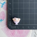 Detailed macro view of a pink and white resin ice cream miniature showing 1.2cm size - Purple Cup Bread Ice Cream