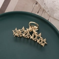 Elegant gold metal hair claw clip featuring a unique hollow star design for women hair accessory - Gold