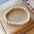 Minimalist natural freshwater pearl bracelet with 14K gold-filled bead on jewelry box - Minimalist Pearl Bracelet 1# (White Baroque)