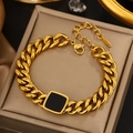 Close-up of golden stainless steel chain bracelet with square black enamel inlay detail - Gold Black Square Stainless Chain (JX731)
