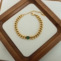 Golden Cuban chain bracelet with a central round green gemstone inlay and lobster clasp - Gold Round Zirconia Bracelet