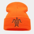 Close-up of bright orange beanie featuring detailed black turtle embroidery on the cuff - Orange Red