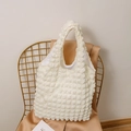 Detail showing white waffle textured puff tote bag with soft popcorn fabric surface - Beige
